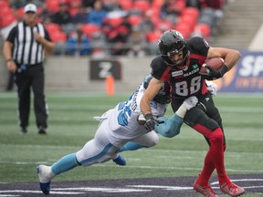 Toronto Argonauts linebacker Justin Herdman-Reed tackles Ottawa Redblacks wide receiver Brad Sinopoli in the first half at TD Place Stadium on Saturday.