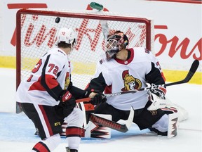 Ottawa Senators goalie Anders Nilsson, right, allows a goal to Vancouver Canucks' Elias Pettersson, not seen, as J.T. Miller (9) and Ottawa's Thomas Chabot (72) watch during second period NHL pre-season hockey action in Abbotsford, B.C., on Monday, Sept. 23, 2019.