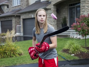 Up and comer Nepean Wildcats hockey player Sarah Thompson, 17, who played on Canada's U-18 team this summer, practises outside of her house.