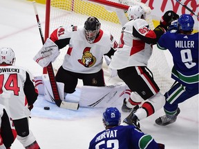 Sep 25, 2019; Vancouver, British Columbia, CAN; Ottawa Senators goaltender Craig Anderson (41) blocks a shot on net by the Vancouver Canucks during the second period at Rogers Arena.