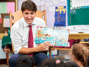 Liberal Leader Justin Trudeau reads a story to Grade 1 and 2 students at a campaign stop in London, Ont. on Monday.