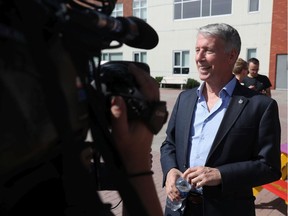 Orléans Liberal MP Andrew Leslie talks to the media In Orléans on Thursday.