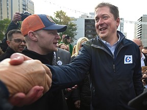 Conservative Leader Andrew Scheer greets suporters after campaigning at candidate James Cumming's campaign office on Jasper Avenue on a election stop in Edmonton, September 28, 2019.