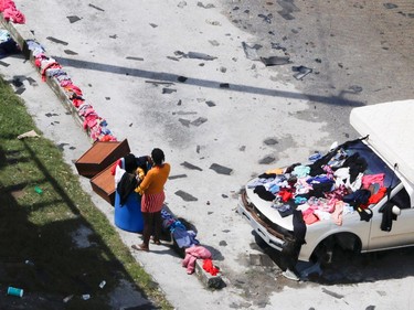 A resident dries clothing and a mattress after hurricane Dorian hit the Grand Bahama Island in the Bahamas,September 4, 2019.