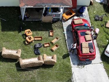 Residents dry belongings after hurricane Dorian hit the Grand Bahama Island in the Bahamas,September 4, 2019.