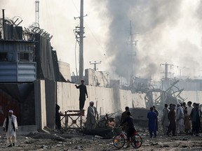 Angry Afghan protesters burn tires and shout slogans at the site of a blast in Kabul, Afghanistan September 3, 2019.