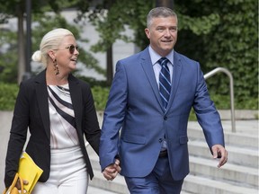 Tim Tierney, city councillor of Beacon Hill-Cyrville Ward, arrives at the Elgin Street courthouse with his wife Jenny Tierney.
