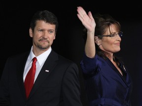 Then-vice-presidential nominee, Alaska Governor Sarah Palin, and her husband Todd Palin walk out on stage during the election night rally at the Arizona Biltmore Resort and Spa on November 4, 2008 in Phoenix, Arizona.