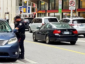 Police and bylaw officers are out to ensure downtown traffic keeps moving Wednesday.