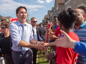 Liberal leader Justin Trudeau greets supporters while campaigning Sunday,  in Brampton, Ont.