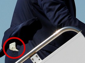 U.S. President Donald Trump boards Air Force One with what appears to be a $20 bill in his back pocket at Moffett Federal Airfield in Mountain View, California, U.S., September 17, 2019.x