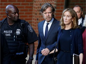 Actress Felicity Huffman, right, leaves the federal courthouse with her husband William H. Macy, after being sentenced in connection with a nationwide college admissions cheating scheme in Boston. Well, at least she said she was sorry.