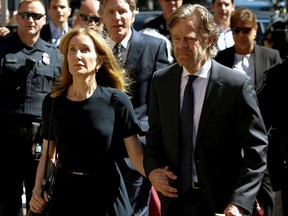 Actress Felicity Huffman arrives at the federal courthouse with her husband William H. Macy, before being sentenced in connection with a nationwide college admissions cheating scheme in Boston, Massachusetts, U.S., September 13, 2019.