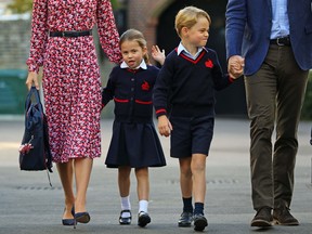 Britain's Princess Charlotte of Cambridge, with her brother, Britain's Prince George of Cambridge, arrives for her first day of school at Thomas's Battersea in London on September 5, 2019.