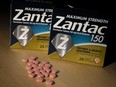 In this photo illustration, packages and pills of Zantac, a popular medication which decreases stomach acid production and prevents heartburn, sit on a table on Sept. 19, 2019 in New York City.
