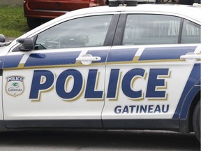 Gatineau police at the scene of a standoff on Boulevard Saint-René Ouest in Gatineau on Wednesday, July 26, 2017.   (Patrick Doyle)  ORG XMIT: 0727 stand off 07