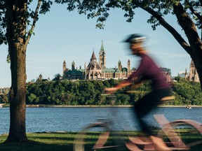 Riding along the Ottawa River in front of Parliament.