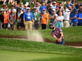 OAKVILLE, ON - JULY 26:  Dustin Johnson plays a shot from a bunker on the 18th hole during the first round at the RBC Canadian Open at Glen Abbey Golf Club on July 26, 2018 in Oakville, Canada.