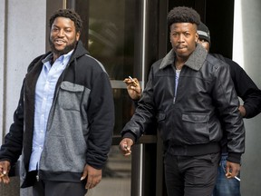 Brothers Federique, left, and Jean-Paul Theragene leave the Ottawa Courthouse during a break in proceedings.