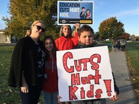 About 20 parents and kids joined a "walk-in" at Terry Fox Elementary School in Orleans on Oct. 10, 2019. Rallies were held at schools across Ontario to protest cuts to education.