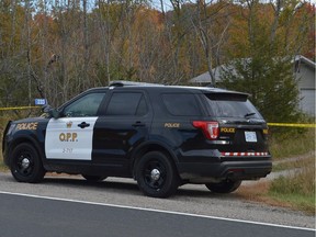 An Ontario Provincial Police SUV is parked outside a residence on County Road 5 north of Mallorytown on Saturday morning.