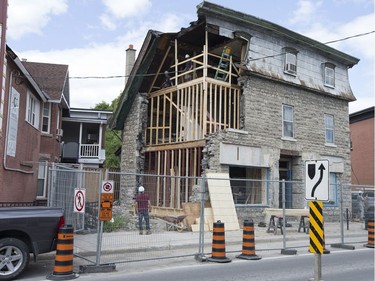 The city of Ottawa has begun shoring up Magee House following a decision by city council to make the building safe enough to reopen the sidewalk.