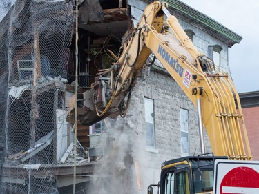 The initial stage of demolition for the Magee House begun on Friday night with crews taking down the south west corner of the building hoping that would be enough to make the building stable enough and the street could be opened to traffic.