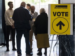 Residents enter the advance polling station at Ottawa City hall on Oct. 11, 2019.