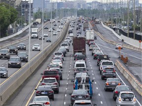 Busy eastbound Queensway traffic as seen from Maitland Avenue.