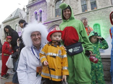 Mayor Jim Watson poses for a photo with Jacob,4, and Tanya Lewkowicz at the "Trick or Treat with the Mayor" Halloween event at City Hall in Ottawa on Saturday, October 26, 2019.   (Patrick Doyle)  ORG XMIT: 1027 mayors halloween 13