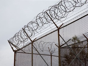 Barbed wire tops the fences of the Ottawa Carleton Detention Centre on Innes Road.