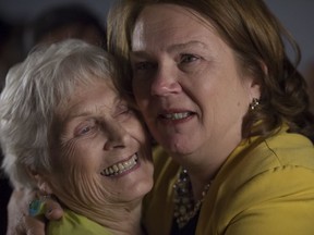 Independent politician Jane Philpott (right) embraces her mother, Audrey Little, after addressing supporters in Stouffville following her election loss Oct. 21.