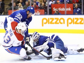 Canadiens' Jordan Weal is stopped by Maple Leafs goalie Michael Hutchinson at Scotiabank Arena in Toronto on Saturday, Oct. 5, 2019.