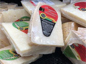 Parmigiano Reggiano and other cheese from Italy is displayed for sale in a grocery store on October 3, 2019 in Los Angeles, California. The Trump administration has slapped $7.5 billion in tariffs on European products including French wine, Italian cheese and Scotch whisky.