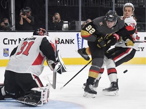 Vladislav Namestnikov of the Ottawa Senators and Tomas Nosek of the Vegas Golden Knights head toward goalie Anders Nilsson, along with the puck, in the second period of their game at T-Mobile Arena on Thursday, Oct. 17, 2019 in Las Vegas.