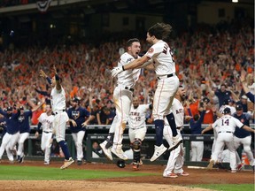 The Houston Astros celebrate their 6-4 win against the New York Yankees on a ninth inning walk-off home run by Jose Altuve (not pictured) in game six of the American League Championship Series at Minute Maid Park on October 19, 2019 in Houston, Texas.