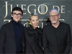 Actor Isaac Hempstead-Wright, left, designer Michele Clapton, middle, and actor Liam Cunningham attend a Game Of Thrones official exhibition presentation at IFEMA in Madrid on Oct. 24,