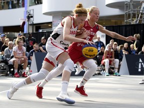Team Canada’s Catherine Traer (left) battles Team Poland’s Martyna Cebulska during the FIBA 3x3 Women’s Basketball Series at West Edmonton Mall in September.