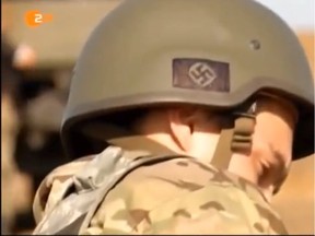 A news broadcast by German ZDF station on September 8 showed soldiers of the Ukraine Azov Battalion in Mariupol with nazi symbols on their helmets.