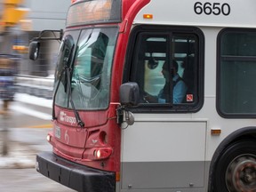 An OC Transpo bus drives along Albert Street in 2018.