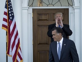 FILE: Donald Trump and Mitt Romney.