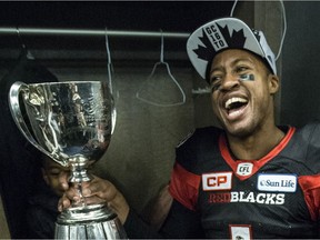 Henry Burris with the Grey Cup after the Redblacks' win in 2016.