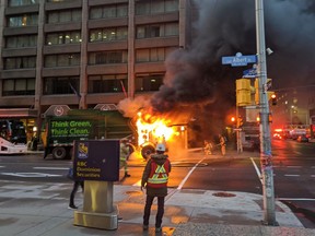 Albert Street was closed between Metcalfe to O'Connor streets as as firefighters doused a flaming garbage truck.
