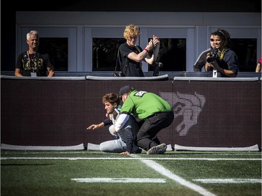 Security chased and tackled a fan who ran out onto the field during the game on Saturday.