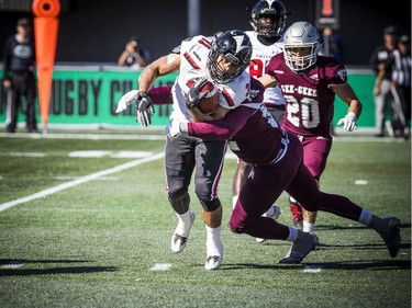 uOttawa Gee-Gee's won the annual Panda Game against the Carleton Ravens at TD Place on Saturday. Gee-Gee's try to stop Ravens #31 Nathan Carter.
