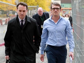 Cameron Ortis (right) walks with his lawyer Ian Carter from the Elgin Street Courthouse in Ottawa after getting out on bail Tuesday (October 22, 2019). Ortis, a former director general with the RCMP, was recently charged under a 2012 security information law used to prosecute spies.