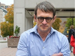 Cameron Ortis (right) walks with his lawyer Ian Carter from the Elgin Street Courthouse in Ottawa after getting out on bail Tuesday,  Oct. 22, 2019.