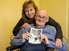 Donna Bertrand and her father Charles Diffin pose for a photo as Charles holds a wedding photo with his bride Joan. Charles and Joan are being cared for in separate health care facilities and Donna has been trying to get them united. October 22, 2019.