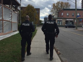 Sgt. Wayne Stangle and Sgt. Andrew Pidcock walk the beat in Vanier as Ottawa police launch their new neighbourhood resource teams.