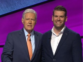 A photo posted on the Twitter account of Ottawa journalist Andrew Thomson, right, on Oct. 25, shows him with Jeopardy! host Alex Trebek.